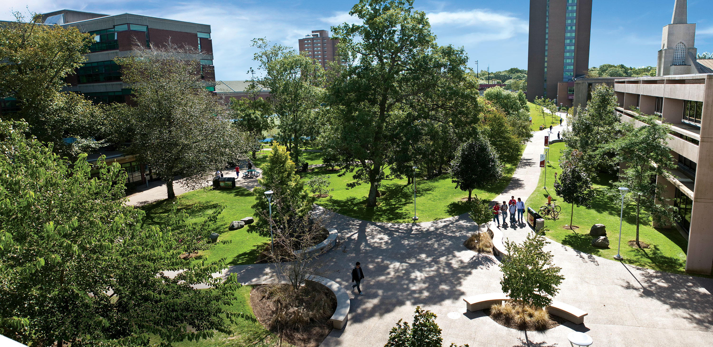 Students walking through the Quod on a sunny afternoon. Shot from above.